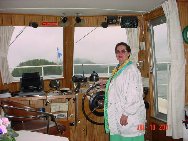 Gloria at helm